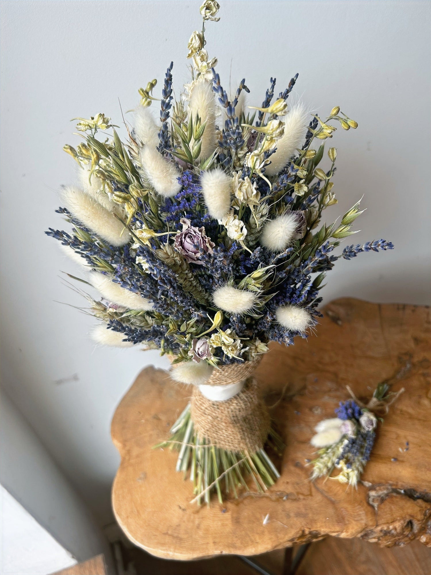 Dried Flower bridal bouquet in lilac and whites including naturally dried lavender, accompanied by a matching dried flower buttonhole